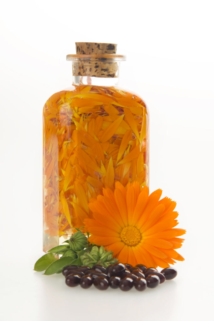 Orange flowers in a bottle.