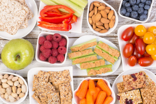 62914016 - healthy snacks on wooden table, top view